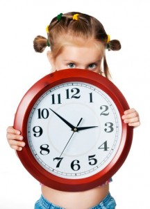 little pretty girl with red big clock